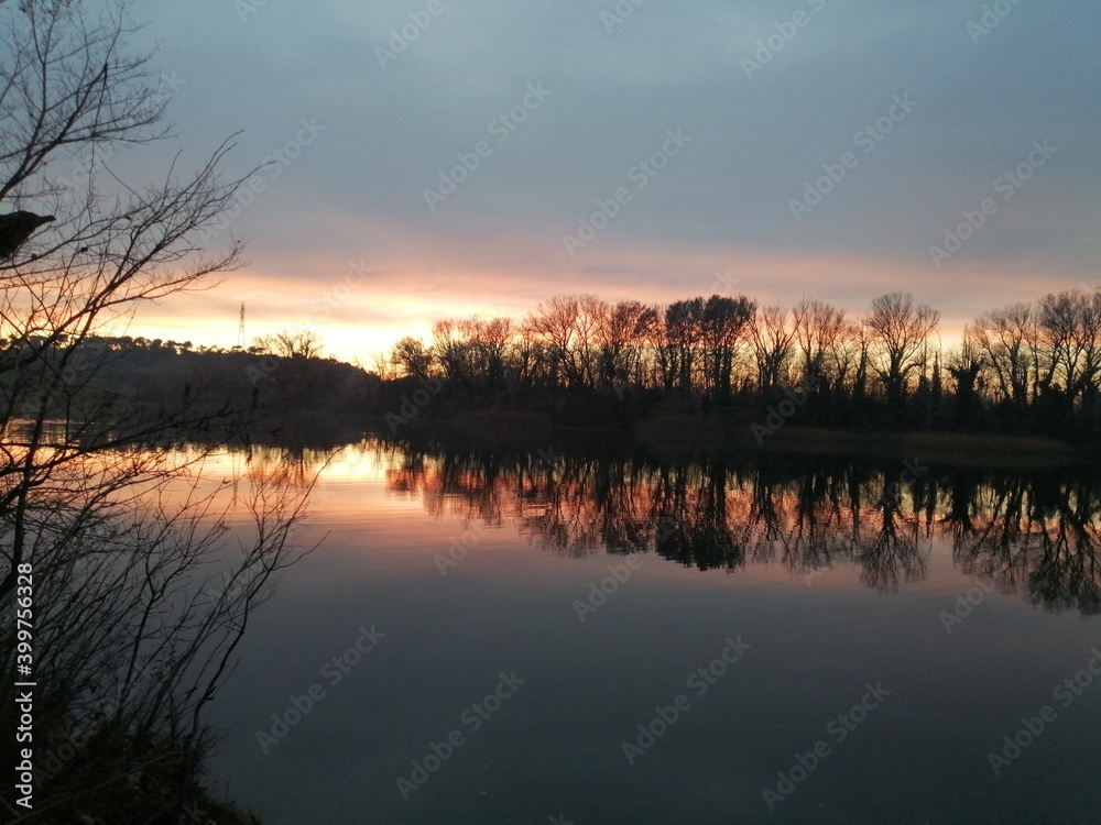 Obraz premium sunset over the river