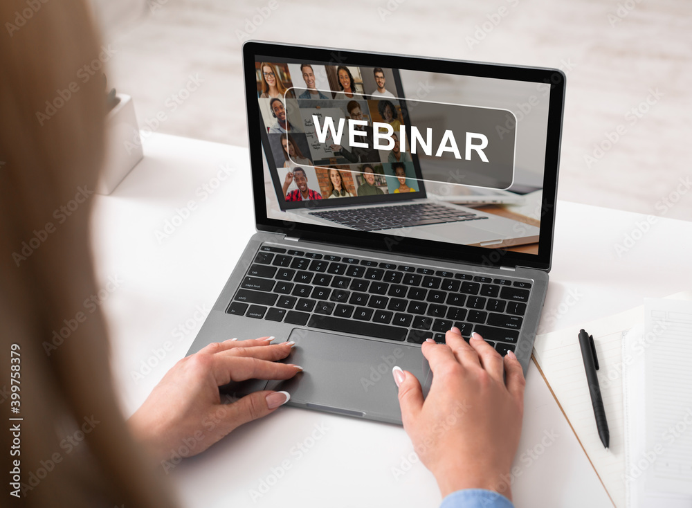 Cropped of woman using laptop, having webinar