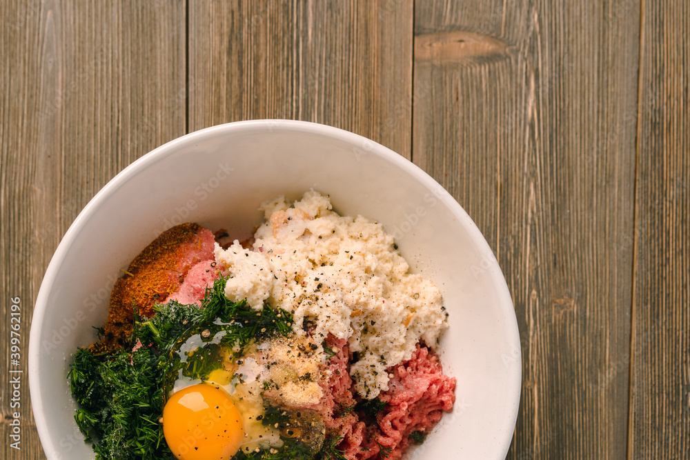 Cooking meat cutlets, in bowls mixed far, egg and seasonings Cooking meat cutlets, in bowls mixed far, egg and seasonings
