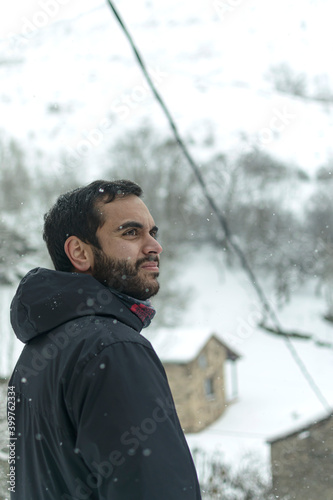 Young man in a snowy landscape in winter
