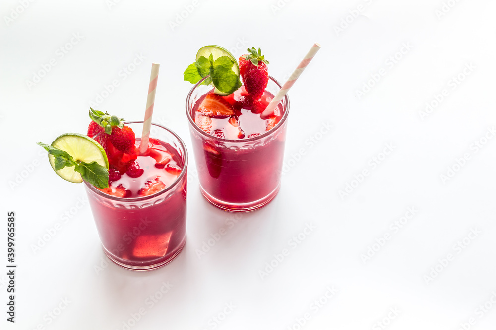 Strawberry cocktail or lemonade with ice and mint. Cold red drink Strawberry cocktail or lemonade with ice and mint. Cold red drink