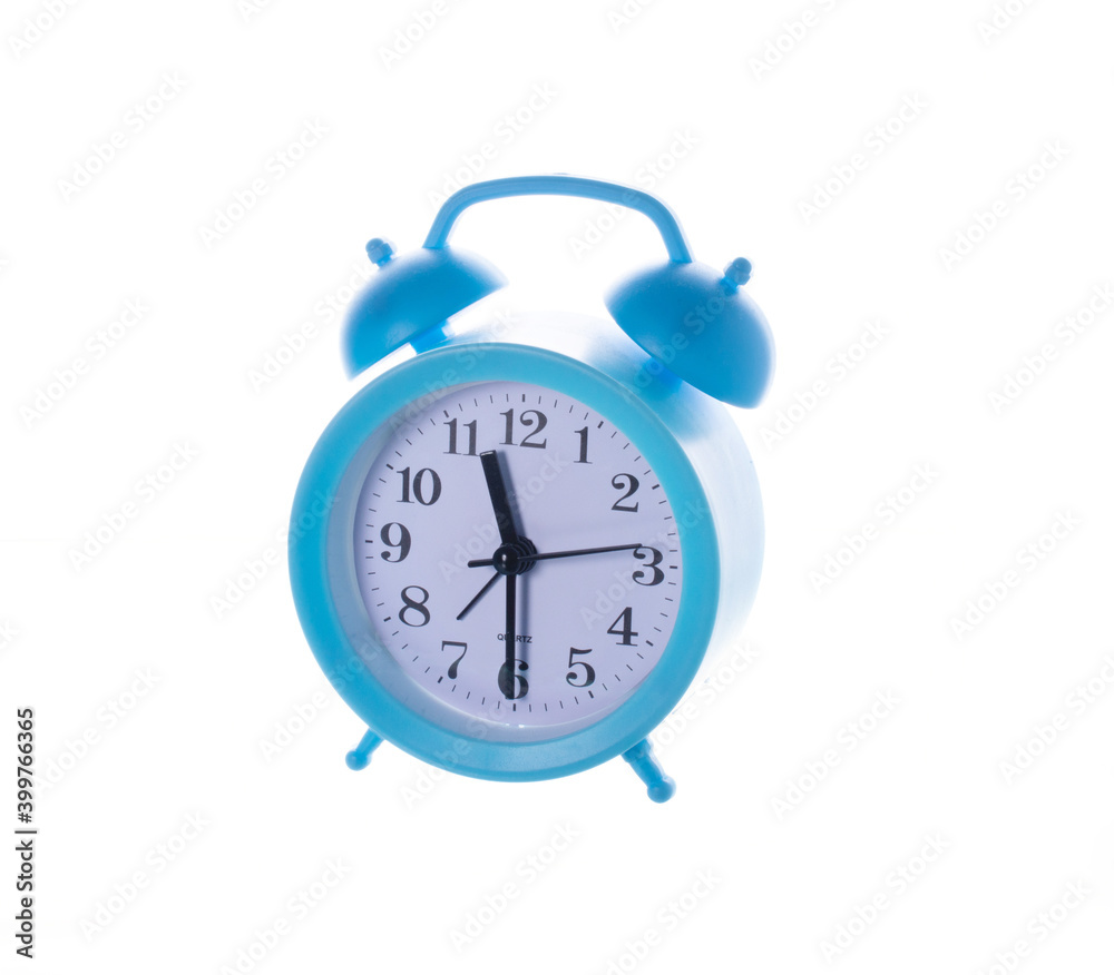 baby blue clock alarm clock with white dial and black numbers isolated on white background. baby blue clock alarm clock with white dial and black numbers isolated on white background.