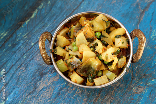 Indian recipe, mixed veg containing potato, Pea, CAULIFLOWER and Eggplant. photo