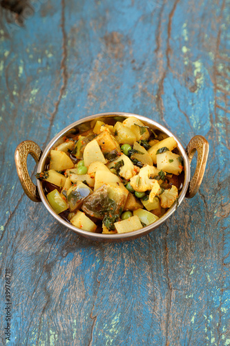 Indian recipe, mixed veg containing potato, Pea, CAULIFLOWER and Eggplant. photo