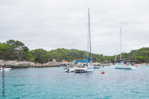 Menorca  Spain - August 4  2020  Nice bay with sailboats and yachts  Cala des Talaier  Menorca  Balearic Islands. Spain.