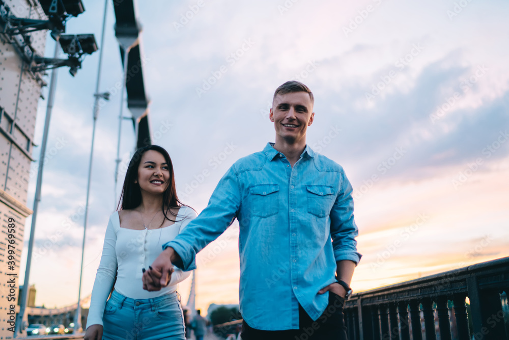 Young couple holding hands during walk
