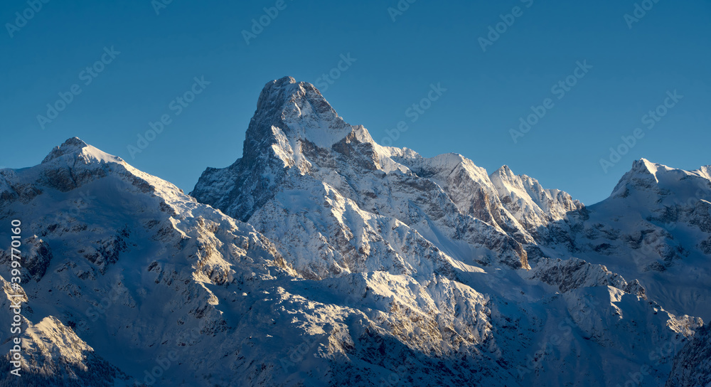 Panoramic view on the Olan Peak in winter in the Ecrins National Park at sunrise. Valgaudemar Valley, Champsaur, Hautes-Alpes (05), Alps, France