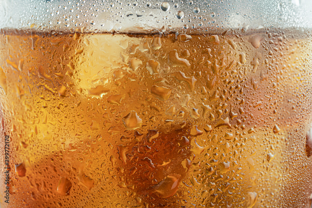 texture of a glass of Golden whiskey close - up-drops and misted glass texture of a glass of Golden whiskey close - up-drops and misted glass