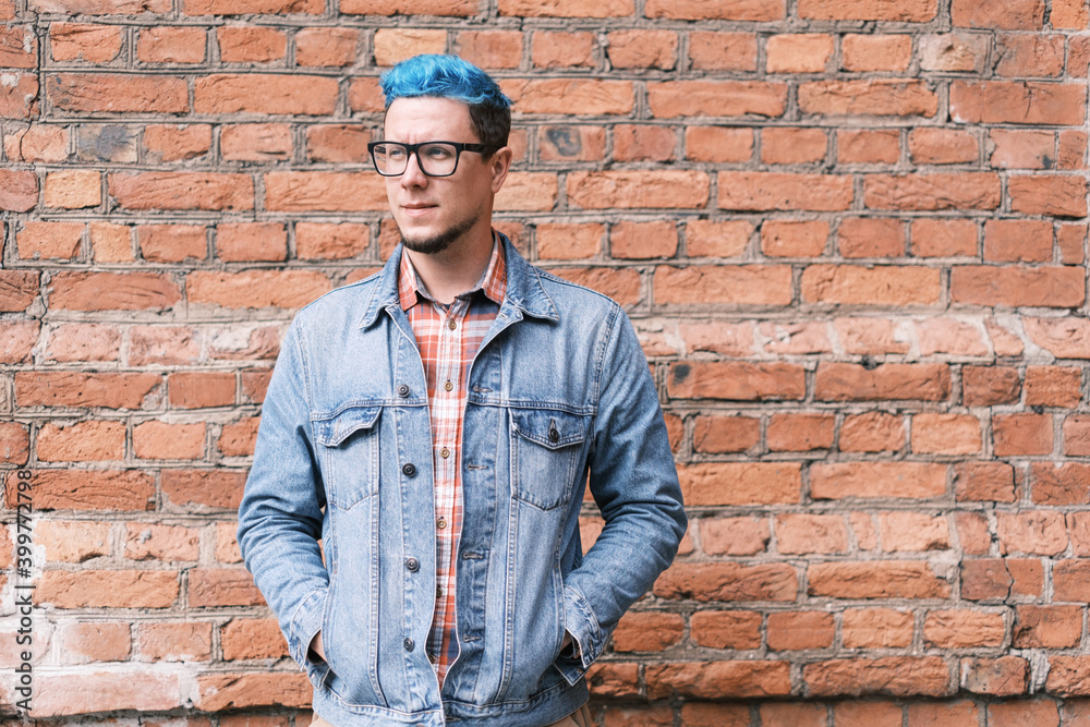 Stylish young man with blue hair. Stylish young man with blue hair.