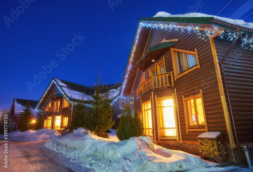 mountain house in the snow photo