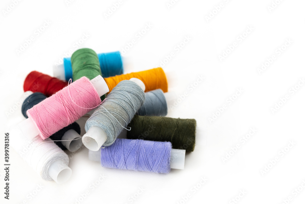 set of thread assorted bright pink, yellow, gray and black yarn for embroidery on a white background set of thread assorted bright pink, yellow, gray and black yarn for embroidery on a white background