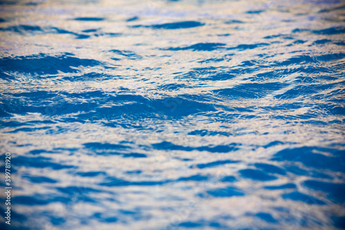 Pool water pattern. Abstract textured picture of a water surface with reflections.