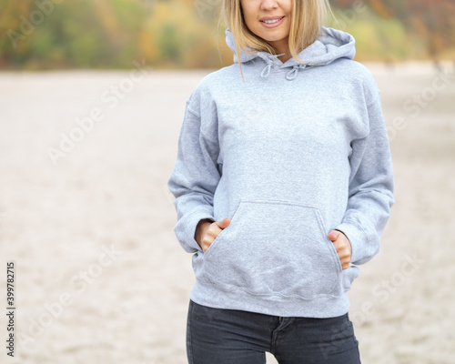 Woman in hoodie with copy space