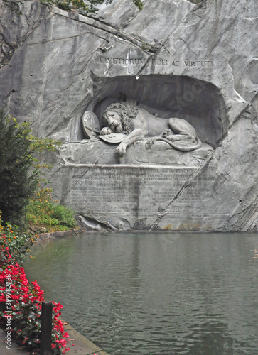 Lion Monument commemorates massacre of Swiss Guards following the French Revolution. The dying lion with a spear in its side was designed by Bertel Thorvaldsen, and created by Lukas Ahorn 1820-21. photo