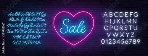 Valentine day sale neon design. Sign Sale in a heart shape frame. White and blue neon alphabets.