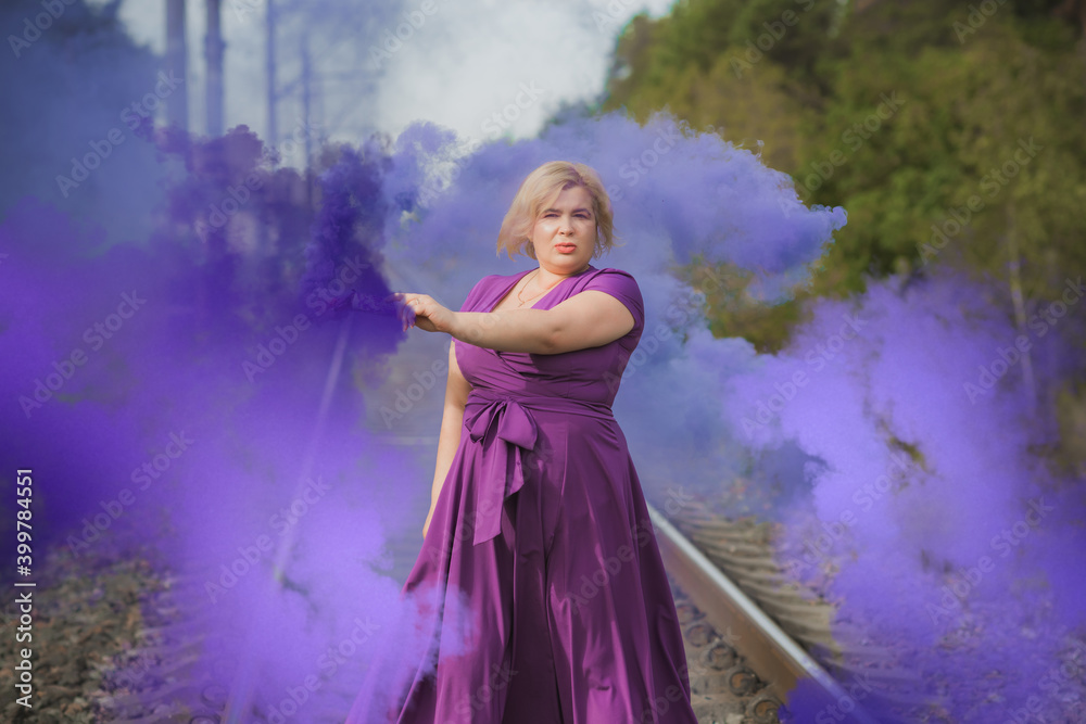 Nice plump lady portrait, lifestyle elegant woman, American chubby woman with a colorful bomb having fun outdoor Nice plump lady portrait, lifestyle elegant woman, American chubby woman with a colorful bomb having fun outdoor