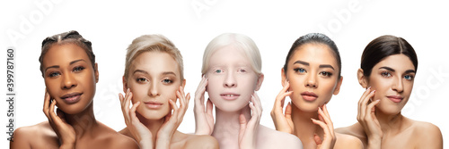 Multi-ethnic beauty. Different ethnicity, beautiful young women with heterochromia on white background. Flyer for ad. Concept of beauty, fashion, healthcare, skincare. Interracial and multiculturalism