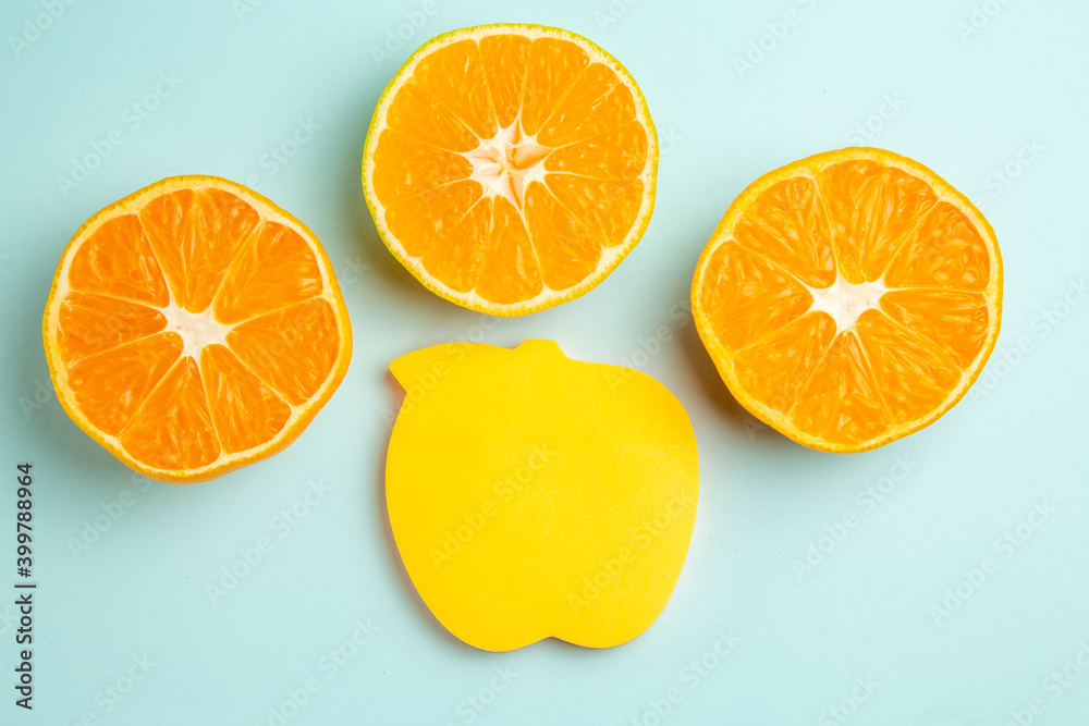 top view fresh tangerine slices with sticker on light-blue background photo fruit color juice citrus orange