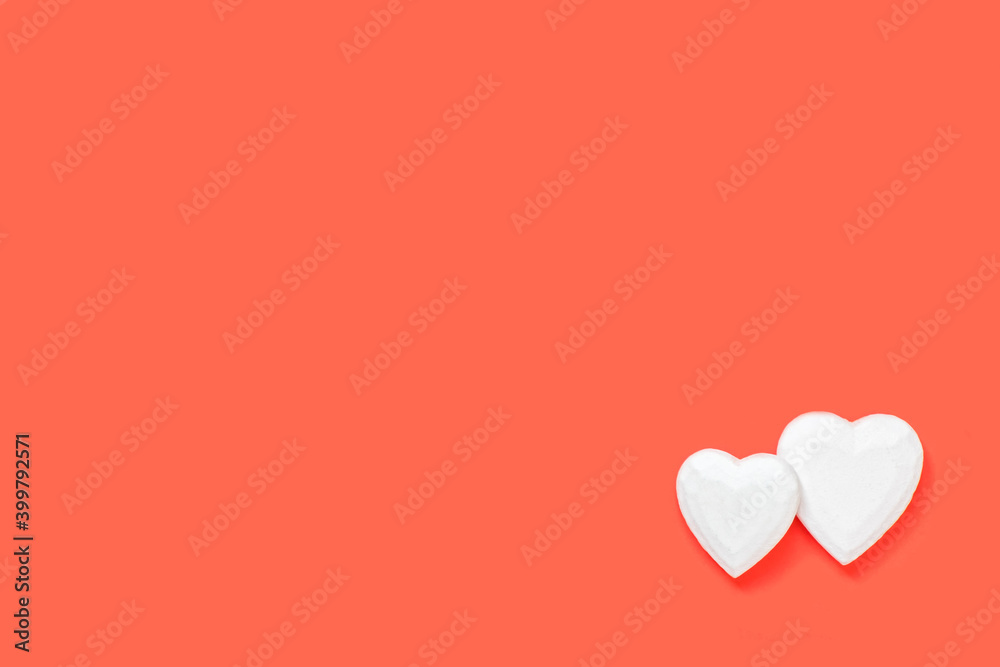 Valentine's day, love, romantic concept. White hearts made of wood on a red background. Copy space