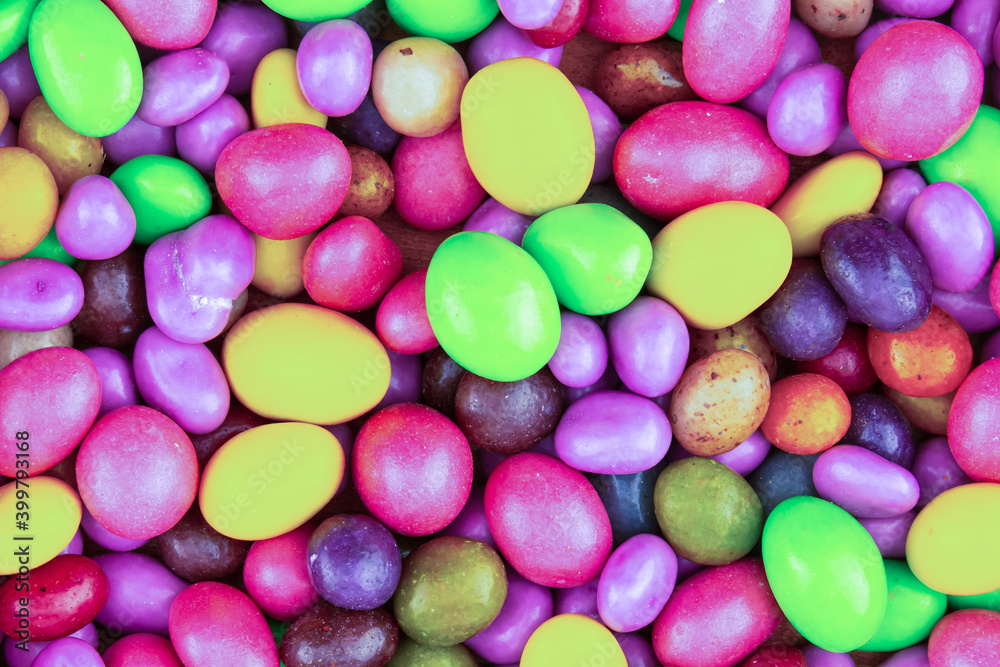 colorful background candy jelly beans yellow, pink and green bright pattern colorful background candy jelly beans yellow, pink and green bright pattern