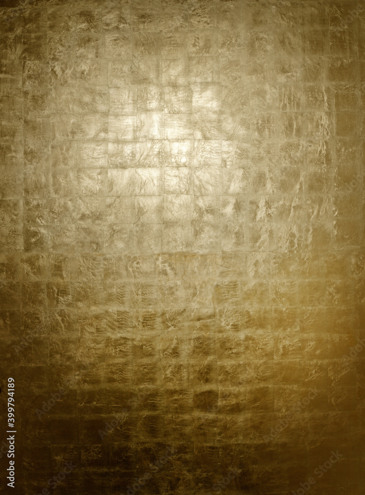 Naklejka premium Luxurious burnished gold leaf surface on background panel