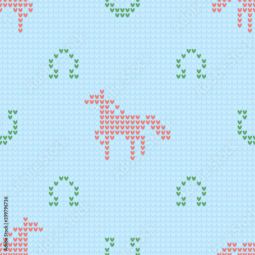 Seamless knitting pattern with horses and horseshoes for sweater, mitten or other textile design is on blue background. Save with the Clipping Mask.