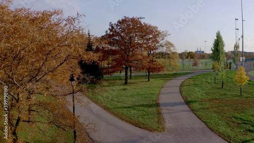 Drone flying over some walking path in a public parc in Montreal photo