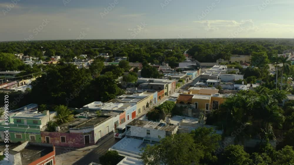 Drone Descends. Colorful Houses on City Street. Tropical Merida, Yucatan, Mexico Drone Descends. Colorful Houses on City Street. Tropical Merida, Yucatan, Mexico