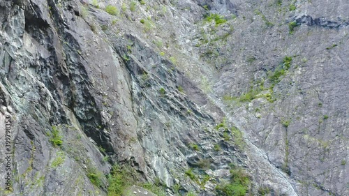 Aerial View Across Stone Cliff Wall In Eisenkappel Vellach, Austria. Follow Shot Parallax photo