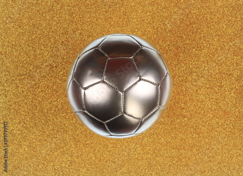 golden soccer ball isolated on golden background