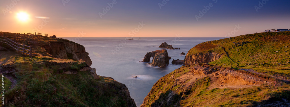 Sunset over Land's End, Longships and the islands of the Armed Knight and Enys Dodnan, Cornwall, UK - obrazy, fototapety, plakaty 