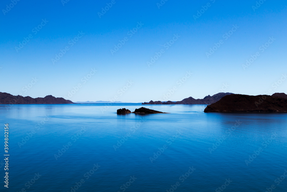 Fototapeta premium View over blue ocean with small islands