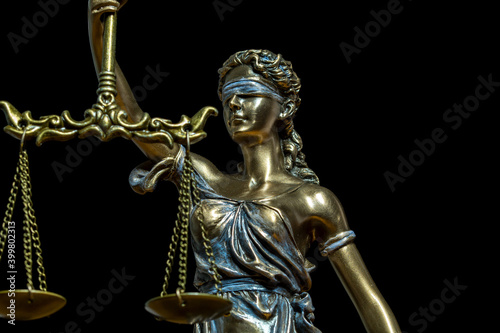 Statue of justice. Close-up Of Justice Lady Against Black Background