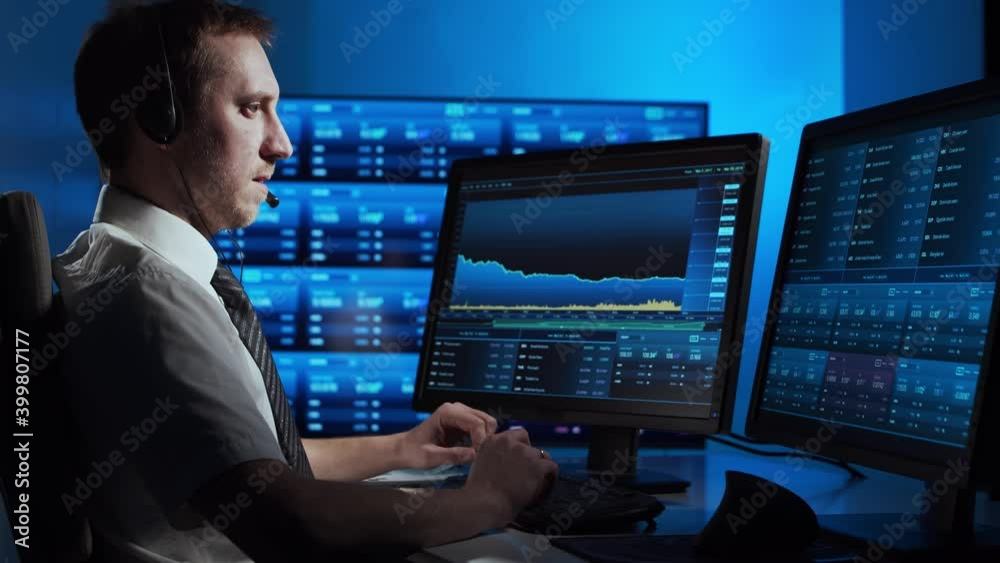 Broker works in office using workstation and analysis technology. Workplace of professional trader. Global financial markets, business, currency exchange and banking concepts. Broker works in office using workstation and analysis technology. Workplace of professional trader. Global financial markets, business, currency exchange and banking concepts.