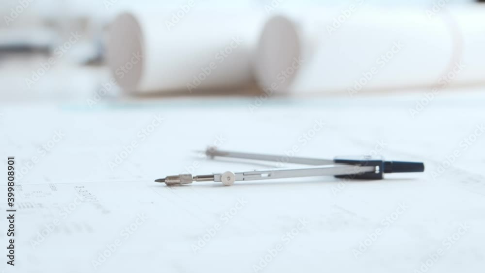Close-up of an architect's hands. Professional real estate designer at the workplace in the office. Close-up of an architect's hands. Professional real estate designer at the workplace in the office.