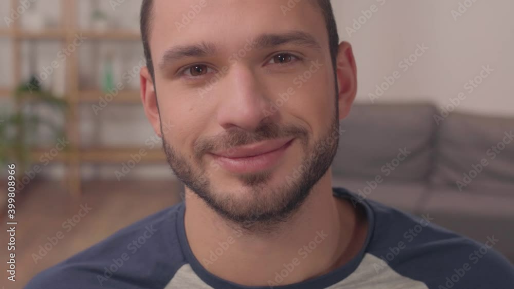 close up of happy hispanic man looking at camera close up of happy hispanic man looking at camera