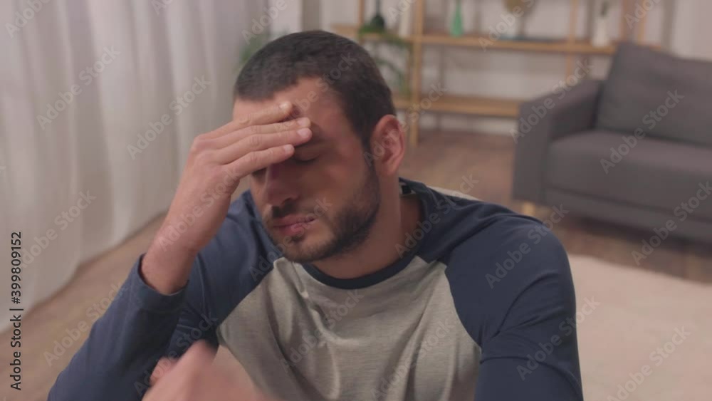 bearded latin man suffering from headache at home bearded latin man suffering from headache at home