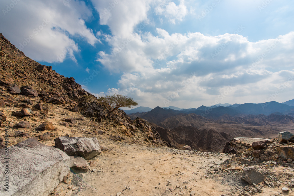 Amazing landscape of  Hajar mountains and mountain lake. Cloudy weather