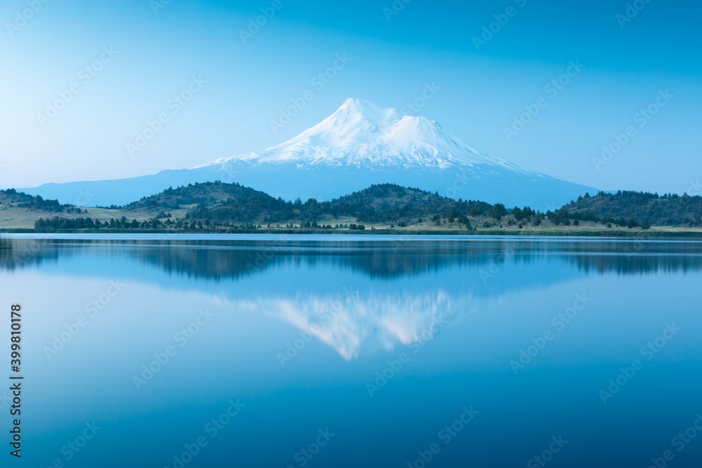 Beautiful Mount Shasta and Siskiyou Lake 
A reflection of snow capped Mount Shasta in a clear water in lake at sunrise in California State, USA. Siskiyou County