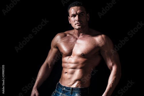 Torso with six pack and ab muscle. Abs and biceps. Strong brutal guy. Sexy torso. Handsome big muscles man posing at studio. Muscular sexy man. Handsome sexual strong man with muscular body