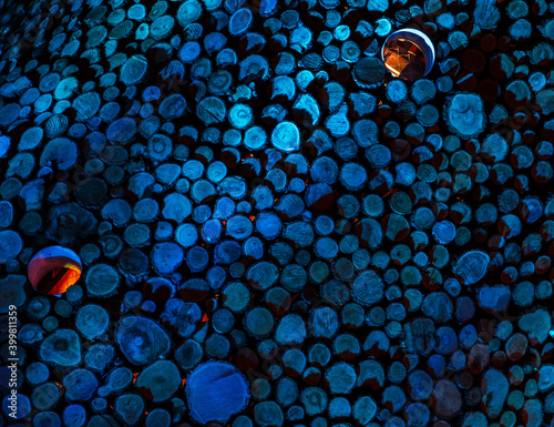 Illuminted, blue circles made of wood in the night photo