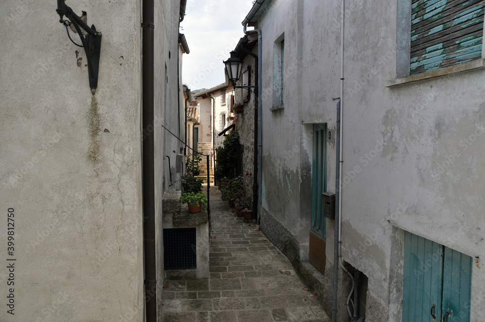 A narrow cobbled street. Street between old houses. Houses of the old city.