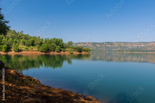 Panoramic view of beautiful Panshet dam with trees located in Pune, Maharashtra, India
