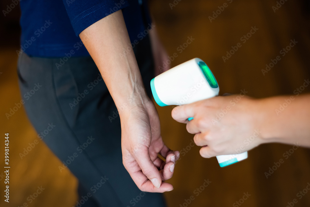 Body temperature measurement with infrared wrist thermometer. Body temperature measurement with infrared wrist thermometer.