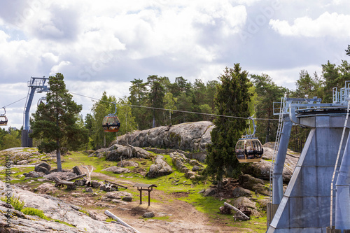 Gorgeous view of cable car way in zoo Sweden. Europe. Beautiful nature landscape background.