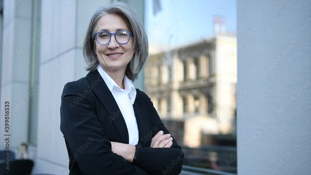 Successful woman lawyer standing with crossed hands, suggesting legal aid