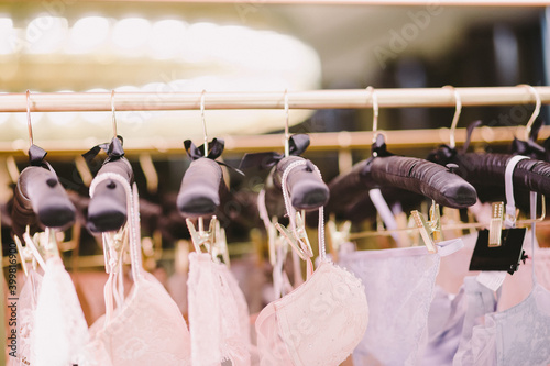 Different bra and panties on pink background. Colorful women sexy underwear. Top view, flat lay. Female wardrobe, shopping concept. Fashion lace lingerie. Black and beige. Big choice of gorgeous bras