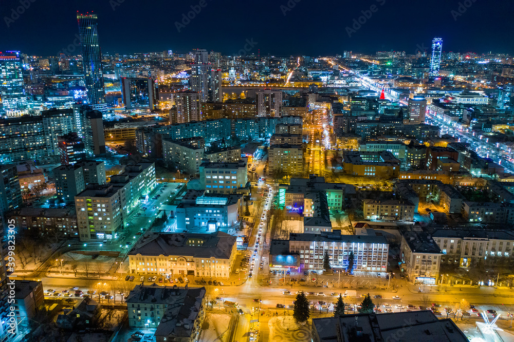 Fototapeta premium Aerial view of the night modern city. Bright lights of the night streets. Ekaterinburg. Russia