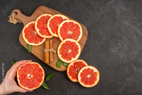 top view fresh grapefruit slices on dark background diet fruit healthy life juice fresh color