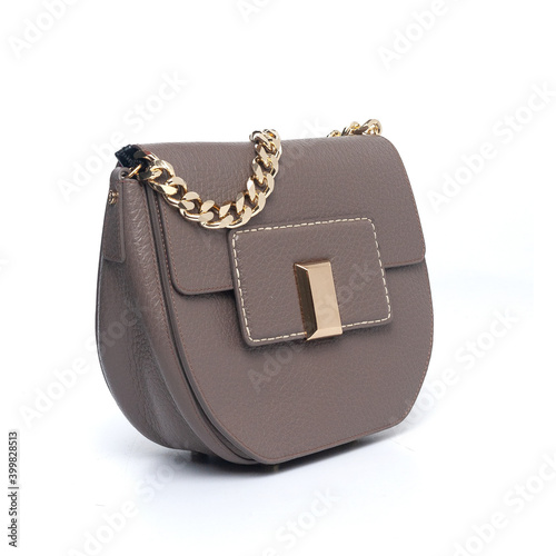 grey leather purse with golden chain isolated on white background (ID: 399828513)